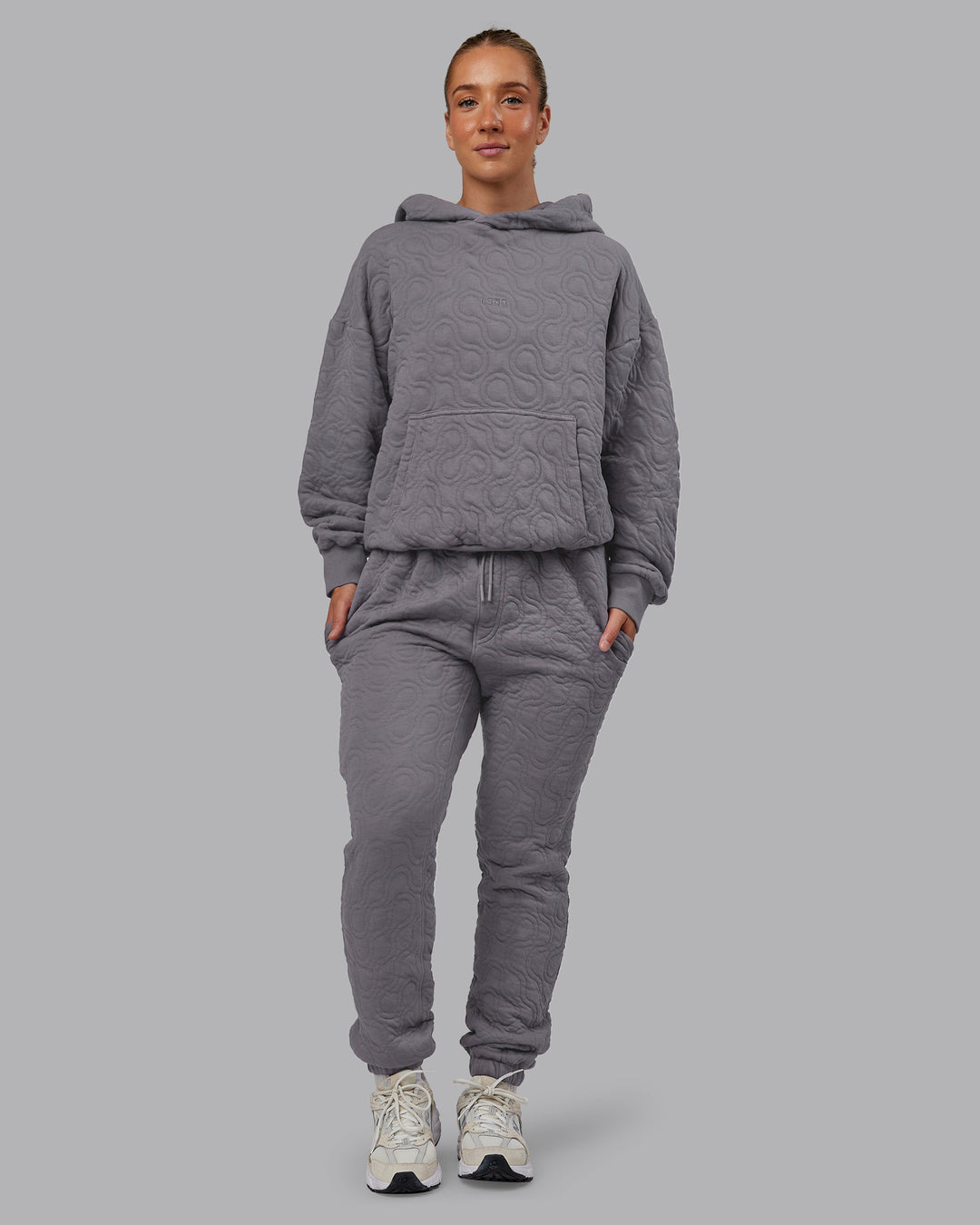 Woman wearing MVP Quilted Track Pant - Storm Front-Geometric | Model:Lyss | Size:XS