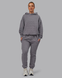 Woman wearing MVP Quilted Track Pant - Storm Front-Geometric | Model:Lyss | Size:XS