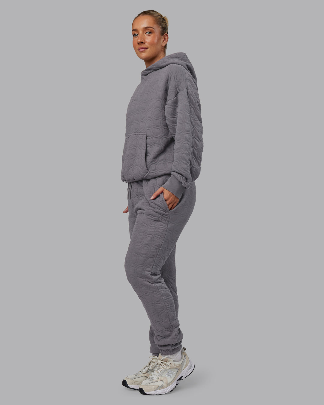 Woman wearing MVP Quilted Track Pant - Storm Front-Geometric | Model:Lyss | Size:XS