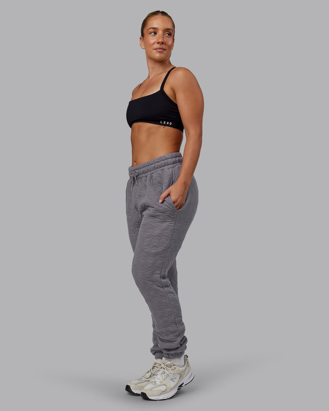 Woman wearing MVP Quilted Track Pant - Storm Front-Geometric | Model:Lyss | Size:XS