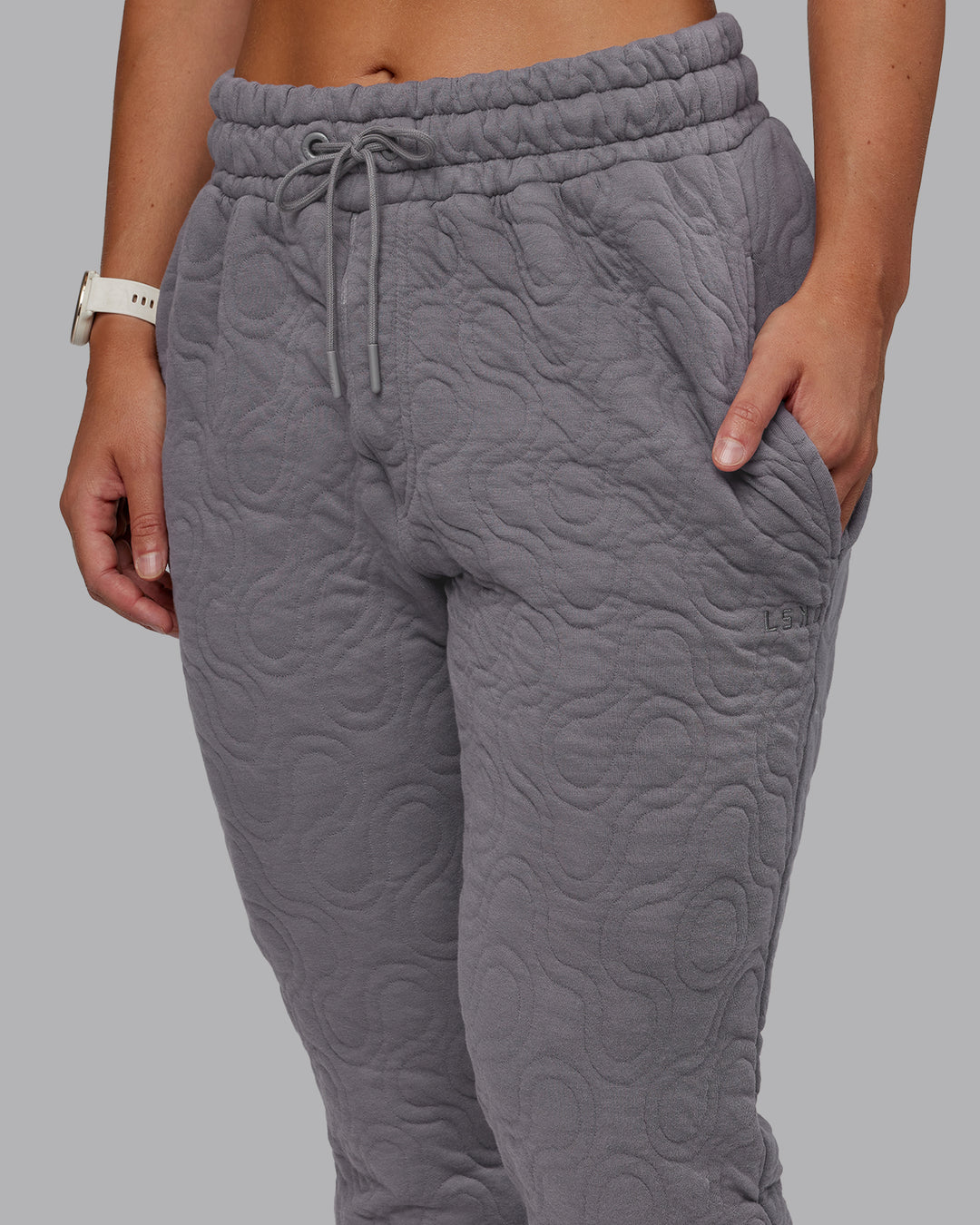 Woman wearing MVP Quilted Track Pant - Storm Front-Geometric | Model:Lyss | Size:XS
