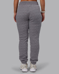 Woman wearing MVP Quilted Track Pant - Storm Front-Geometric | Model:Lyss | Size:XS