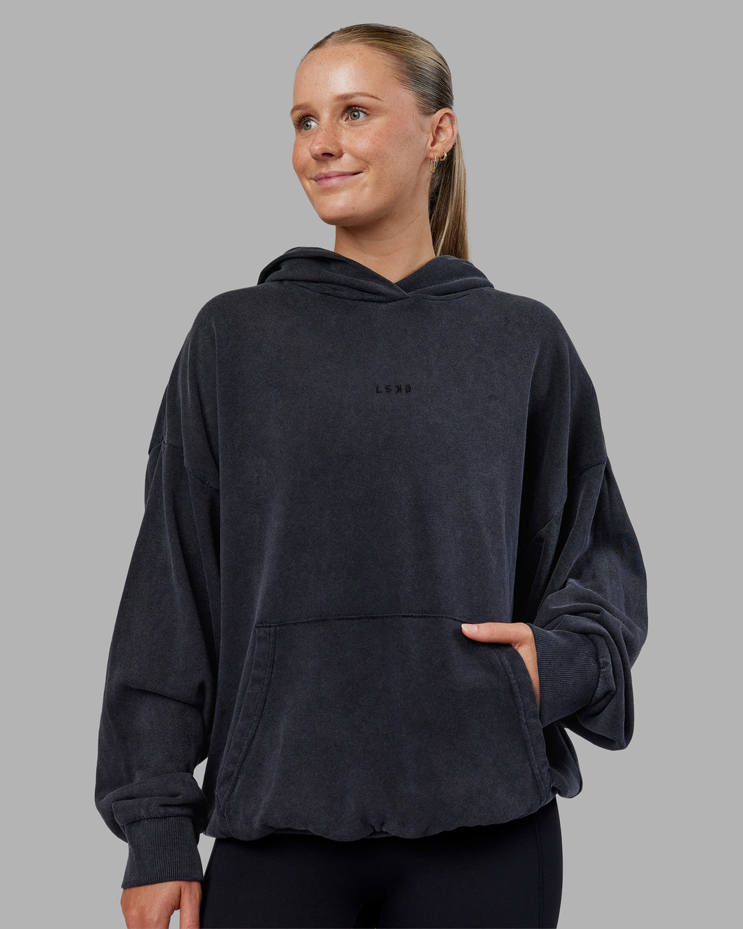 Woman wearing MVP Washed Terry Oversized Hoodie - Black Washed | Model:Neve | Size:XS