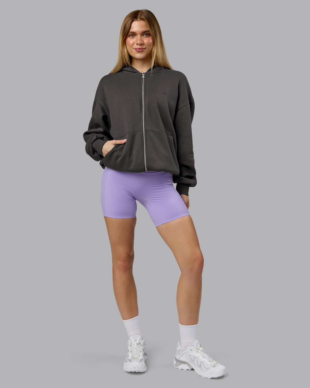 Woman wearing MVP Zip Through Oversized Hoodie - Dark Storm | Model:Emilie | Size:XS