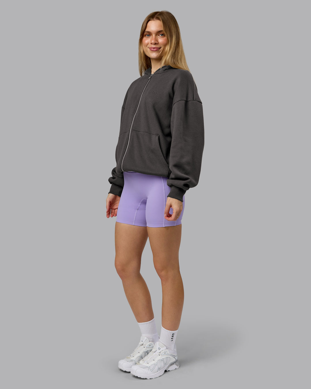 Woman wearing MVP Zip Through Oversized Hoodie - Dark Storm | Model:Emilie | Size:XS
