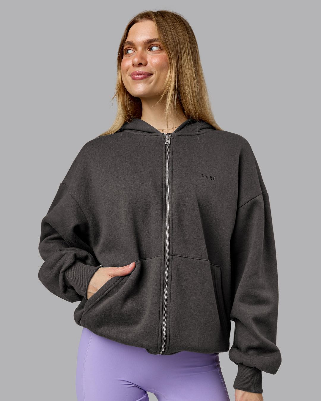 Woman wearing MVP Zip Through Oversized Hoodie - Dark Storm | Model:Emilie | Size:XS