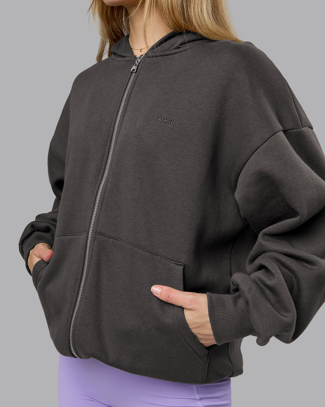 Woman wearing MVP Zip Through Oversized Hoodie - Dark Storm | Model:Emilie | Size:XS