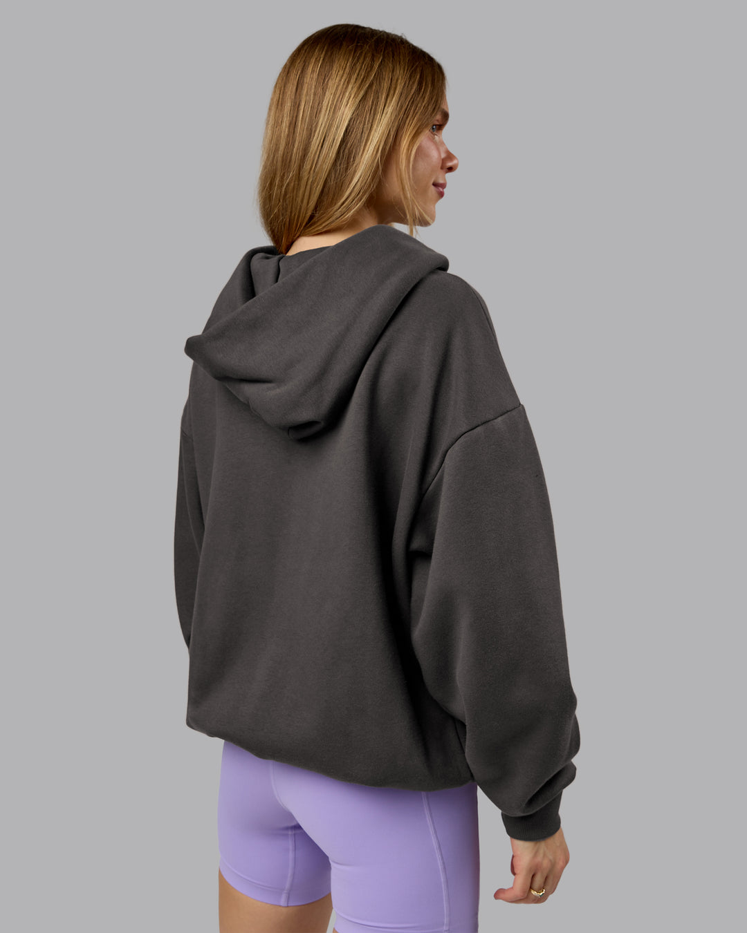Woman wearing MVP Zip Through Oversized Hoodie - Dark Storm | Model:Emilie | Size:XS