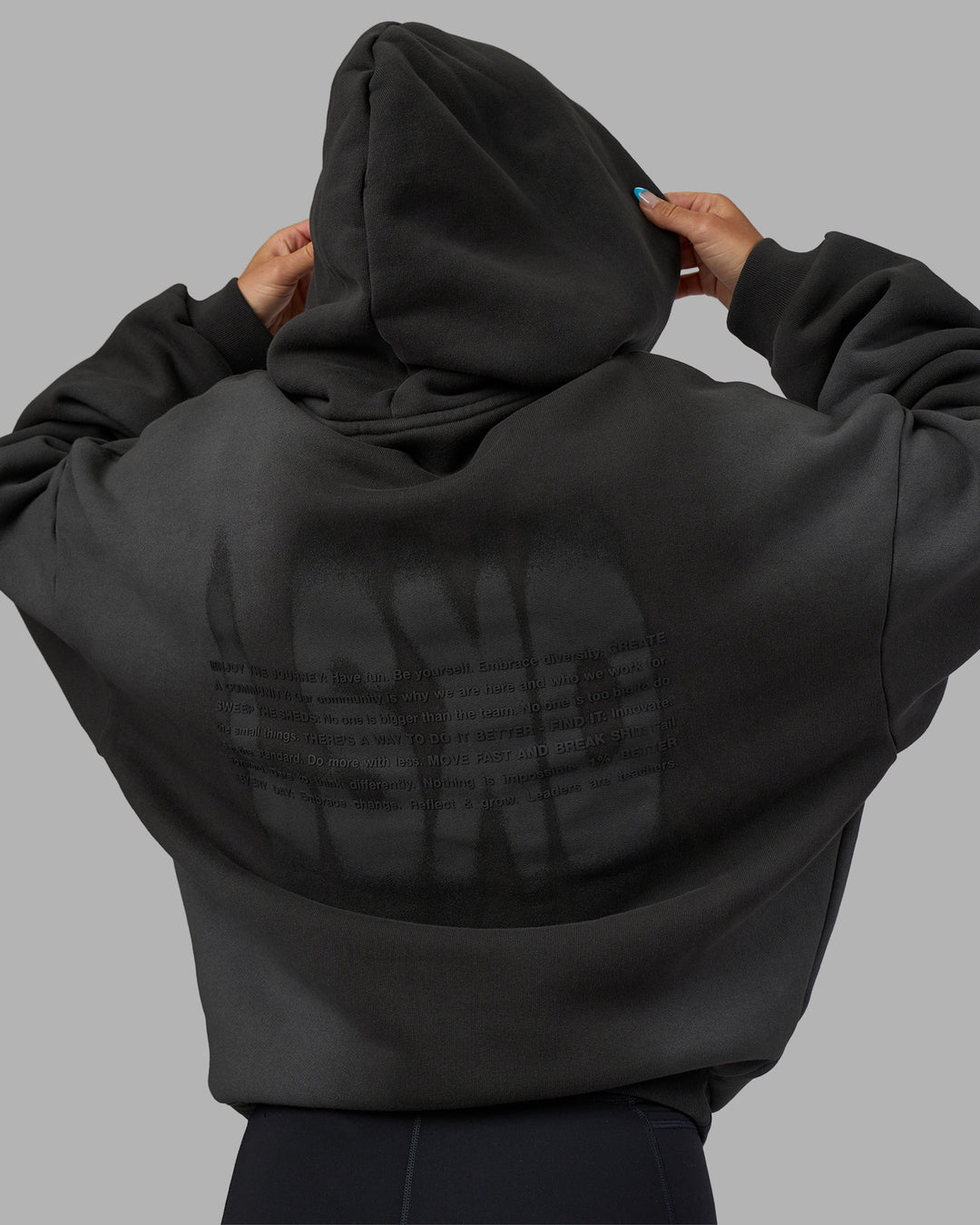 Woman wearing Memory In Motion 500gsm Ultra Heavyweight Washed Hoodie - Charcoal Washed | Model:Alex | Size:XS