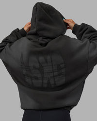 Woman wearing Memory In Motion 500gsm Ultra Heavyweight Washed Hoodie - Charcoal Washed | Model:Alex | Size:XS