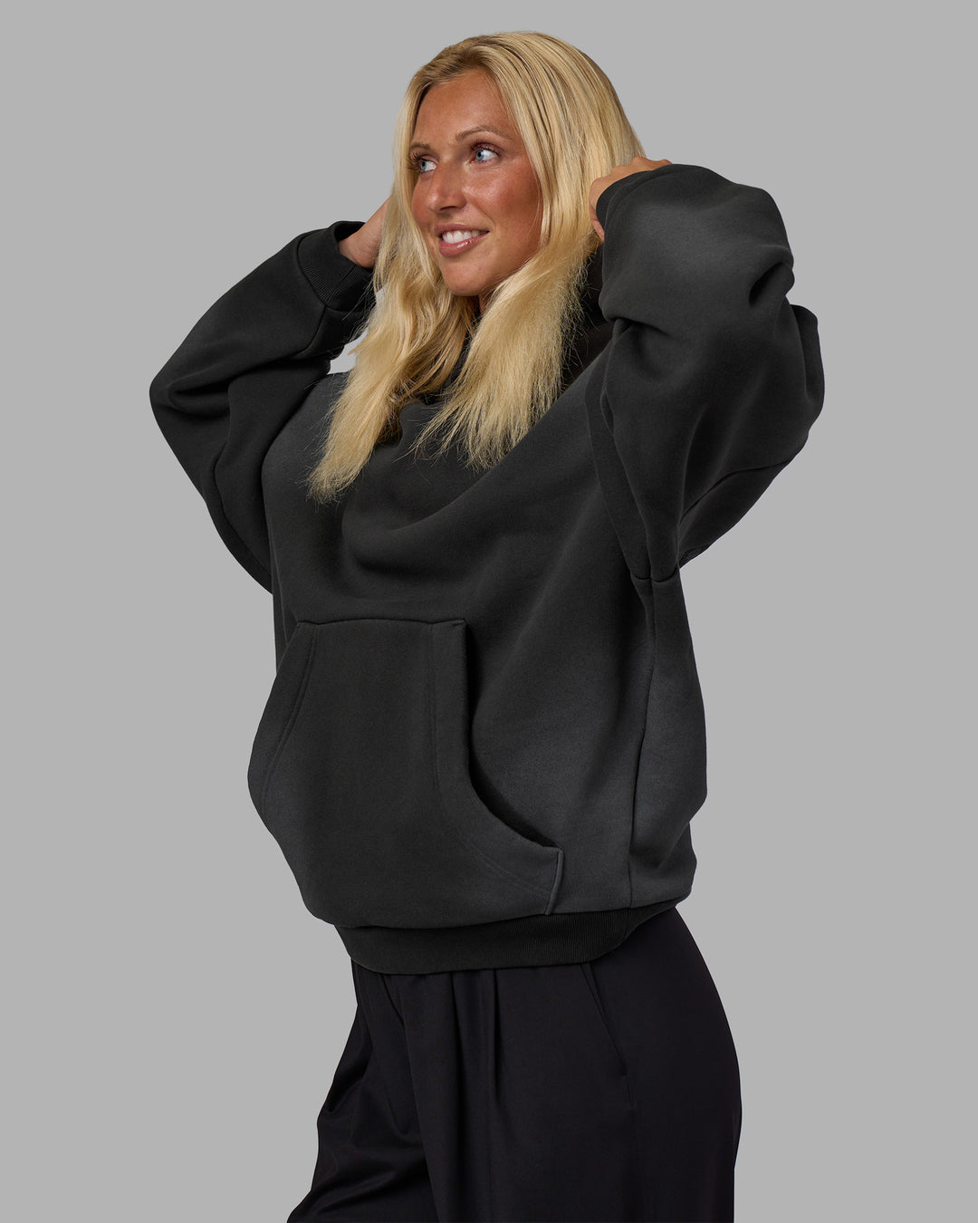 Woman wearing Memory In Motion 500gsm Ultra Heavyweight Washed Hoodie - Charcoal Washed | Model:Alex | Size:XS