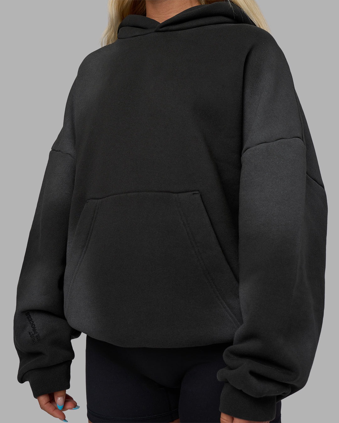 Woman wearing Memory In Motion 500gsm Ultra Heavyweight Washed Hoodie - Charcoal Washed | Model:Alex | Size:XS