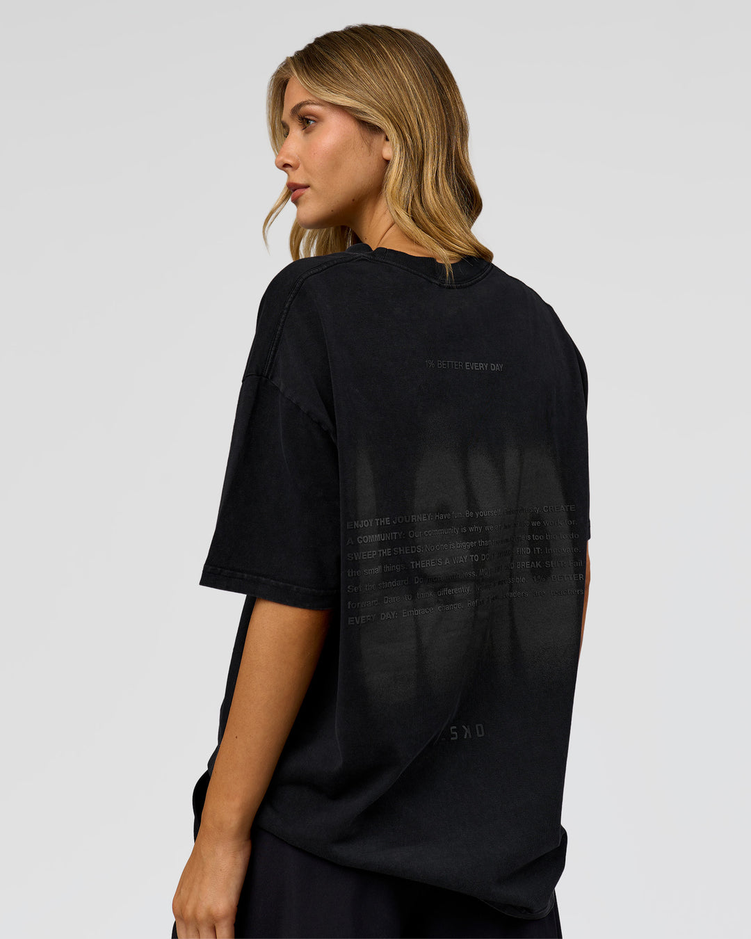 Woman wearing Memory in Motion Heavyweight Oversized Tee - Black Washed | Model:Leilani | Size:XS
