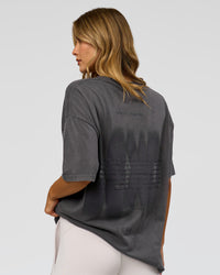 Woman wearing Memory in Motion Heavyweight Oversized Tee - Dark Storm Washed | Model:Leilani | Size:XS