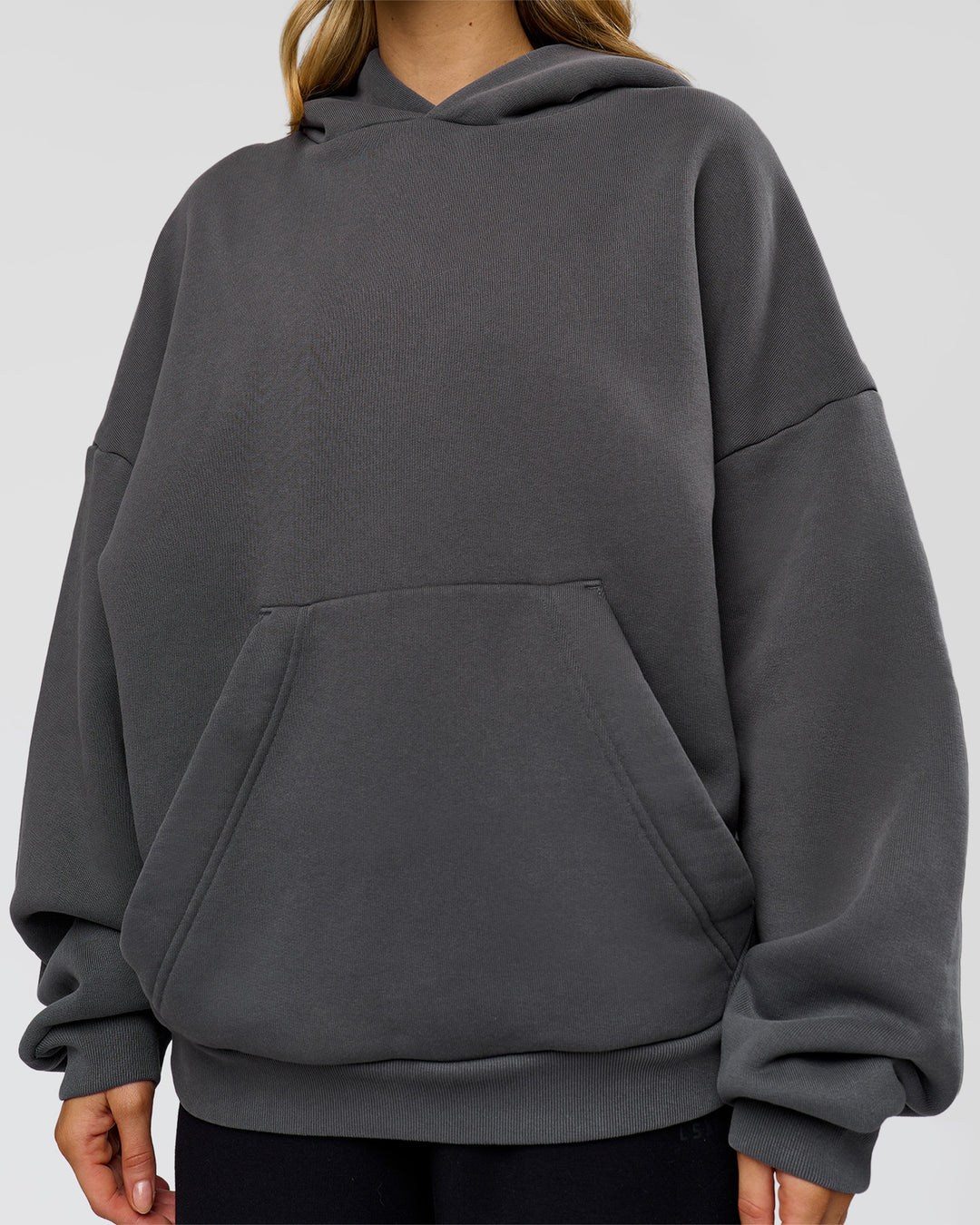 Woman wearing Memory In Motion Ultra Heavyweight Washed Hoodie - Dark Storm Washed | Model:Leilani | Size:XS