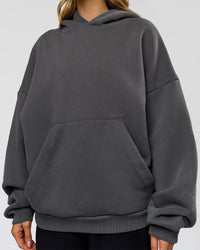 Woman wearing Memory In Motion Ultra Heavyweight Washed Hoodie - Dark Storm Washed | Model:Leilani | Size:XS