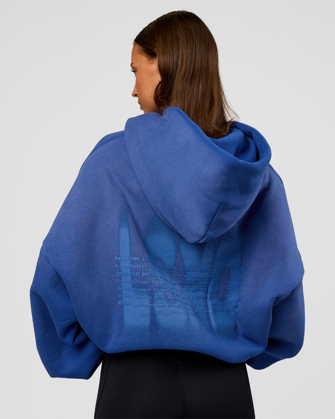 Woman wearing Memory In Motion Ultra Heavyweight Washed Hoodie - Electric Indigo Washed | Model:Brylee | Size:XS