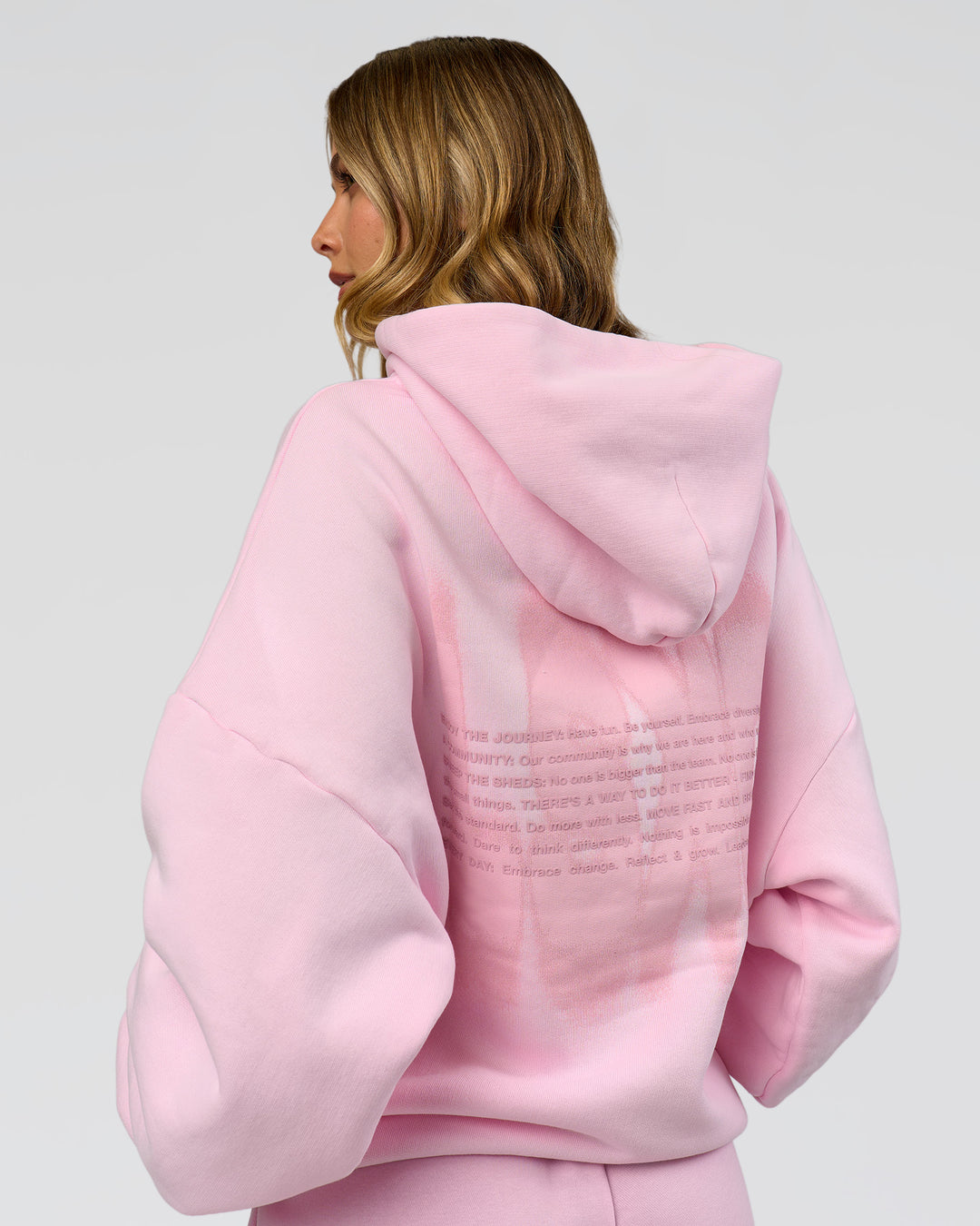 Woman wearing Memory In Motion Ultra Heavyweight Washed Hoodie - Marshmallow Washed | Model:Leilani | Size:XS