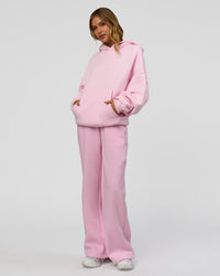 Woman wearing Memory In Motion Ultra Heavyweight Washed Hoodie - Marshmallow Washed | Model:Leilani | Size:XS