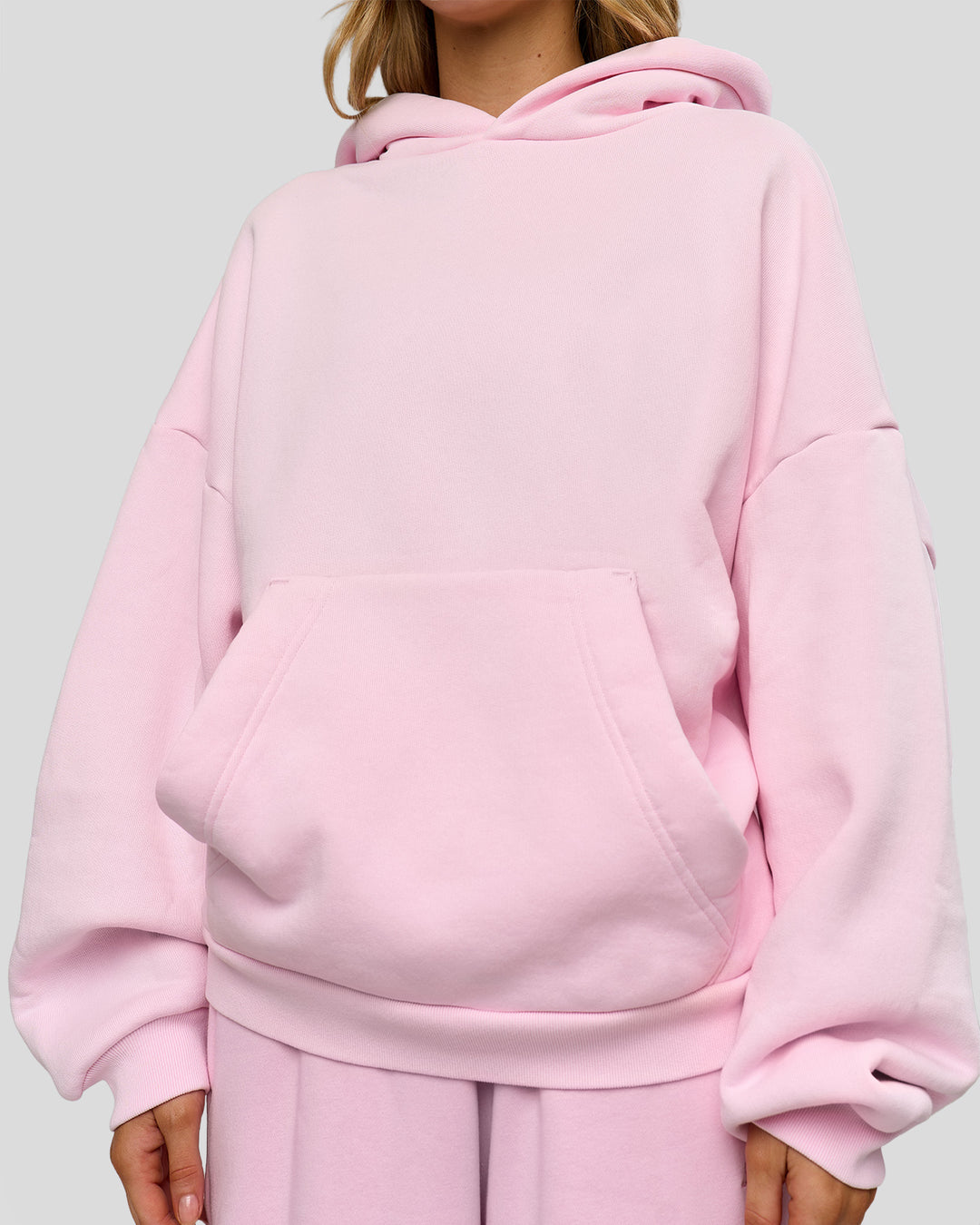 Woman wearing Memory In Motion Ultra Heavyweight Washed Hoodie - Marshmallow Washed | Model:Leilani | Size:XS