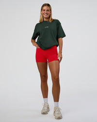 Woman wearing Merry Journey FLXCotton Oversized Tee - Vital Green-White | Model:Amity | Size:XS