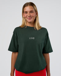 Woman wearing Merry Journey FLXCotton Oversized Tee - Vital Green-White | Model:Amity | Size:XS