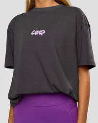 Woman wearing Miami Snatch FLXCotton Oversized Tee - Dark Storm-Marshmallow | Model:Georgia | Size:XS