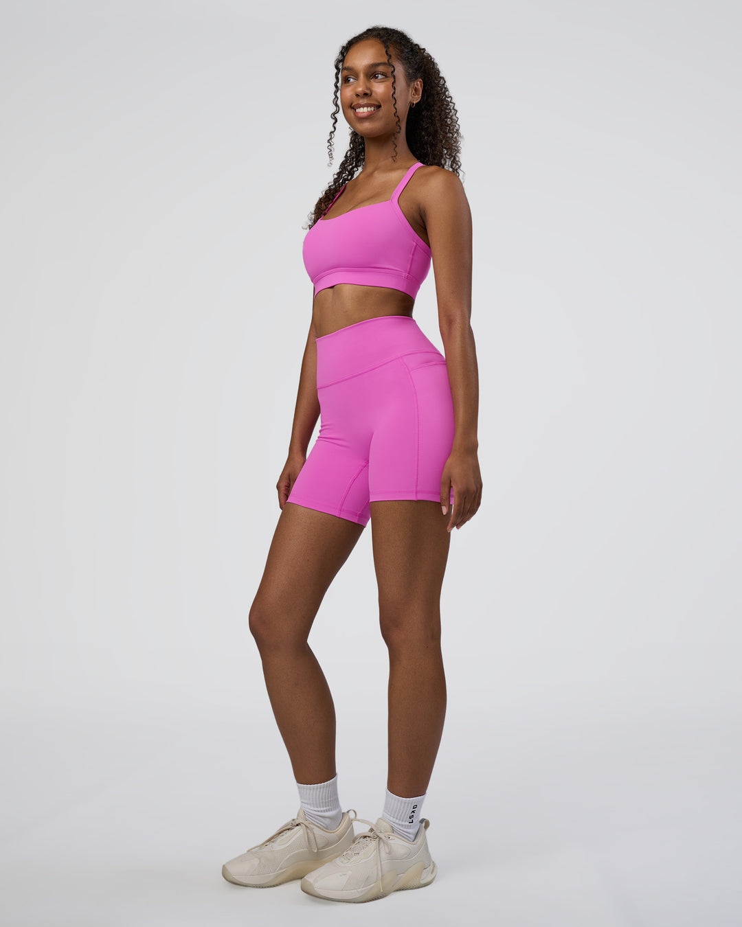 Woman wearing Momentum Sports Bra D/DD/E - Ultra Fuchsia | Model:Jordan | Size:XS