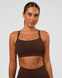 Woman wearing Momentum Sports Bra - Hot Chocolate | Model:Charli | Size:XS