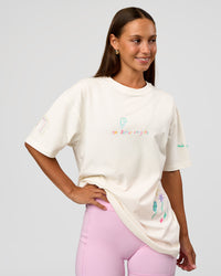 Woman wearing Mother's Day FLXCotton Oversize Tee - Off White | Model:Brylee | Size:XS
