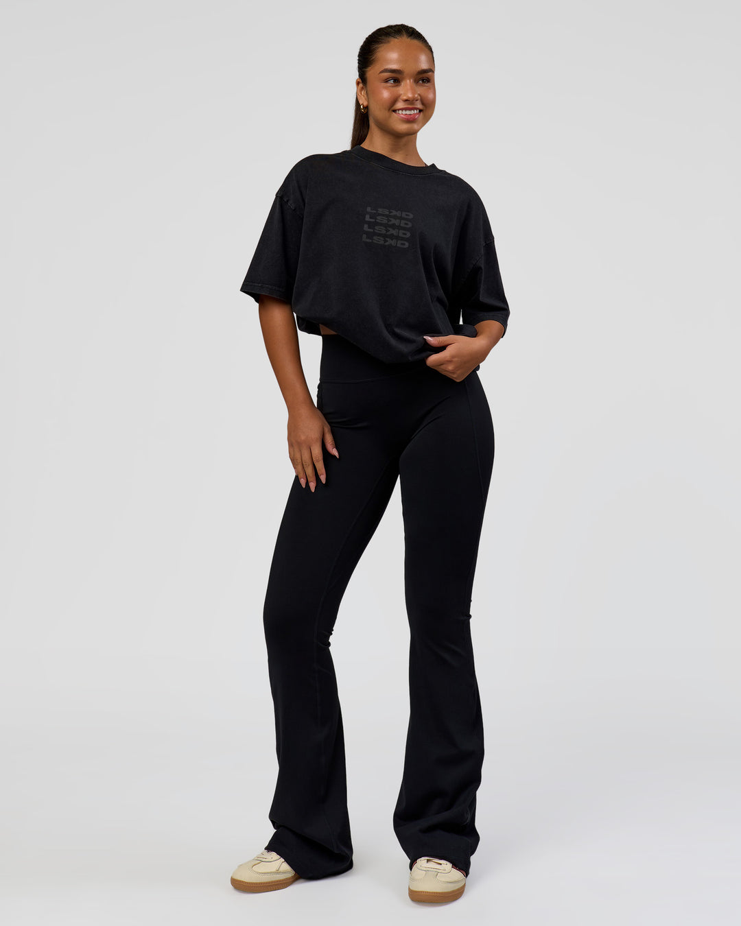 Woman wearing Move Fast Heavyweight Oversized Tee - Black Washed | Model:Sophia | Size:XS