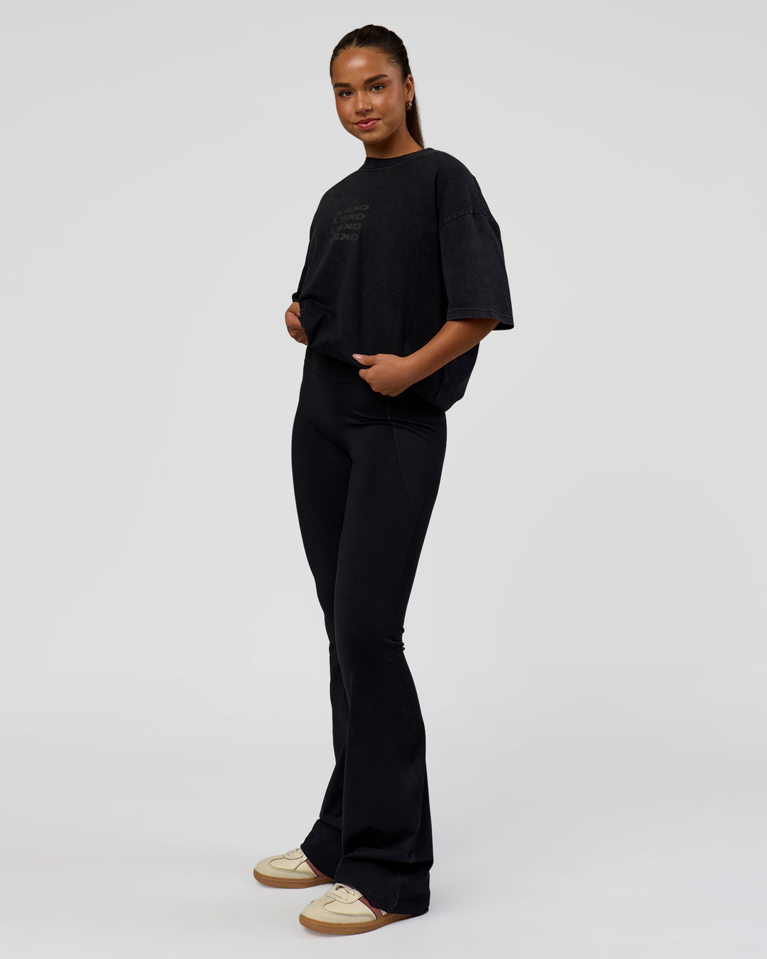 Woman wearing Move Fast Heavyweight Oversized Tee - Black Washed | Model:Sophia | Size:XS
