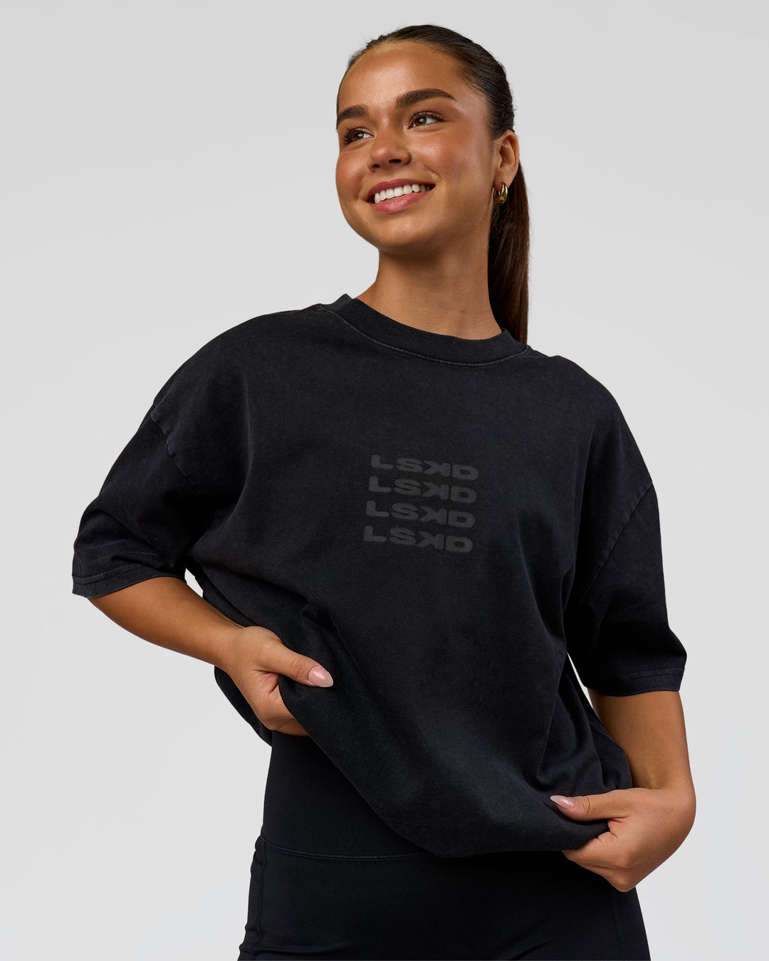 Woman wearing Move Fast Heavyweight Oversized Tee - Black Washed | Model:Sophia | Size:XS