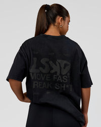 Woman wearing Move Fast Heavyweight Oversized Tee - Black Washed | Model:Sophia | Size:XS