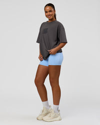 Woman wearing Move Fast Heavyweight Oversized Tee - Dark Storm Washed | Model:Sophia | Size:XS