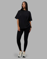 Woman wearing Move Fast Washed Heavyweight Tee Oversize - Black-Island Paradise | Model:Rhiley | Size:XS