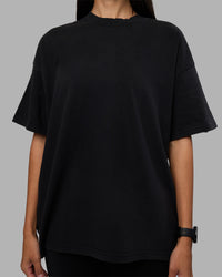 Woman wearing Move Fast Washed Heavyweight Tee Oversize - Black-Island Paradise | Model:Rhiley | Size:XS