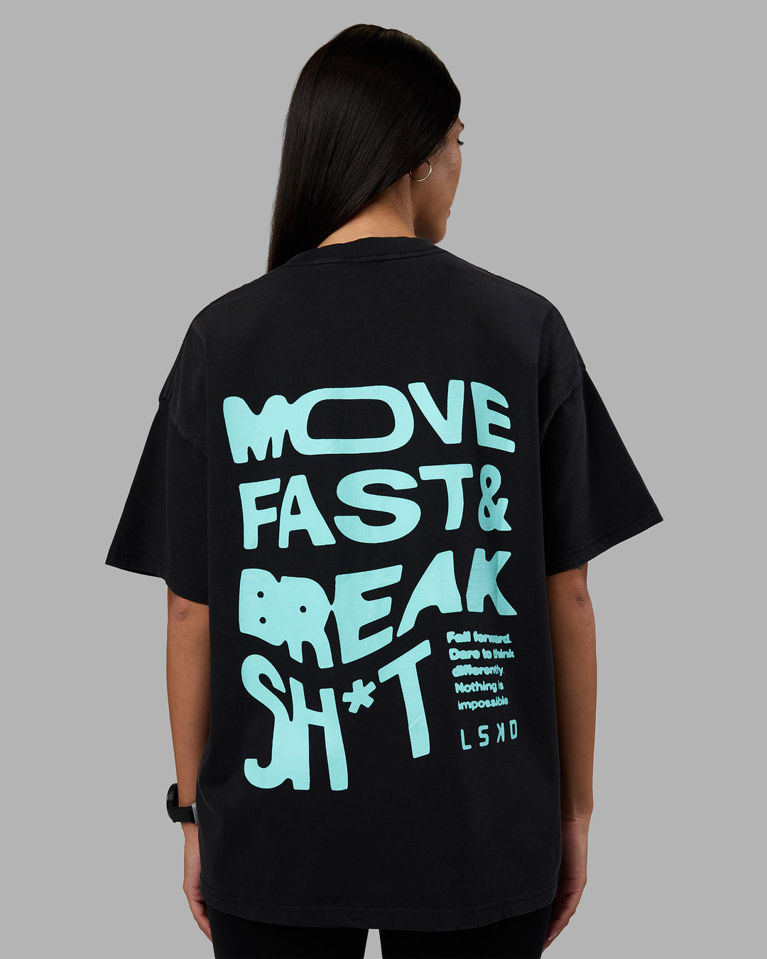 Woman wearing Move Fast Washed Heavyweight Tee Oversize - Black-Island Paradise | Model:Rhiley | Size:XS
