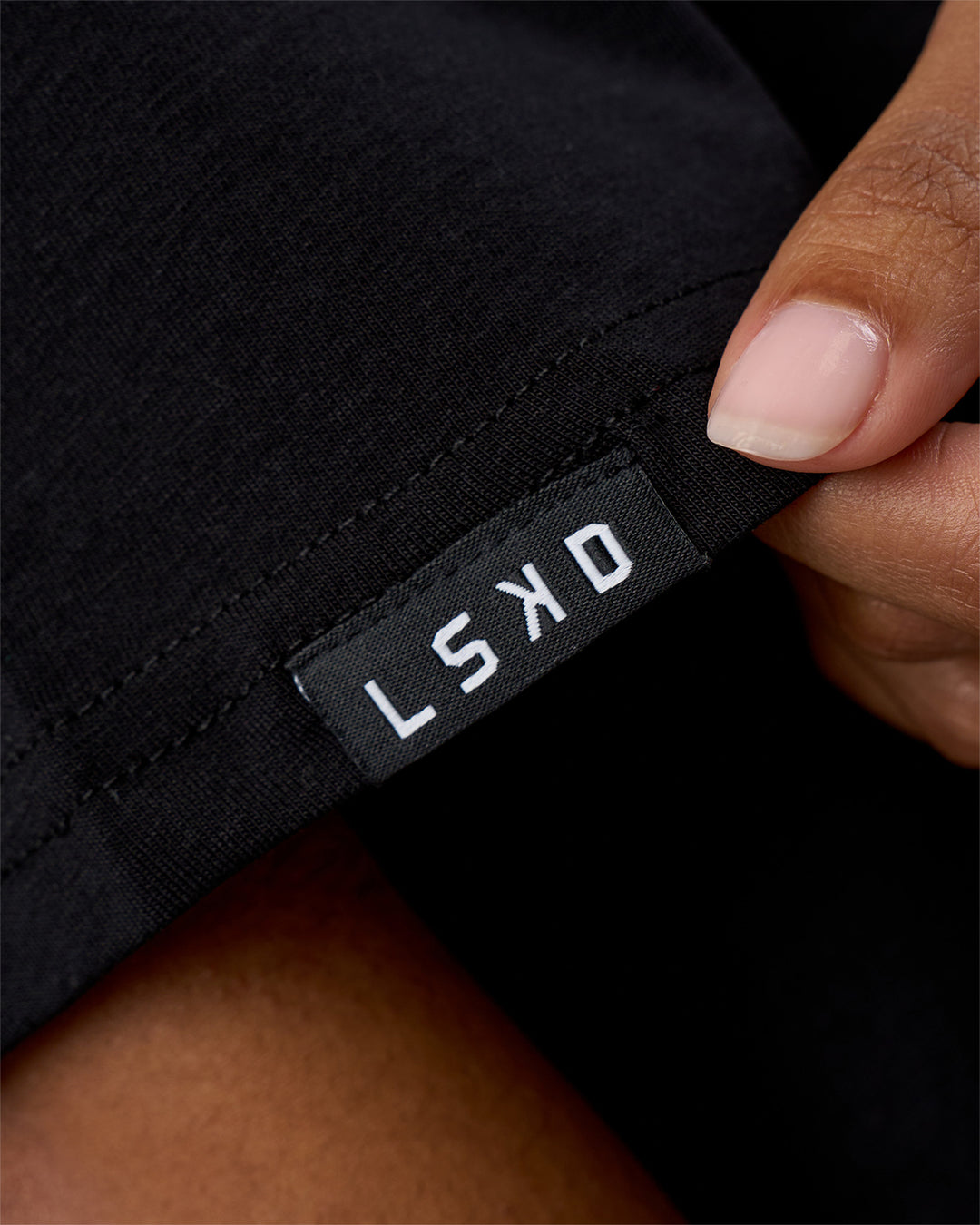 Woman wearing Movember 2025 FLXCotton Oversize Tee - Black | Model:Jordan | Size:XS