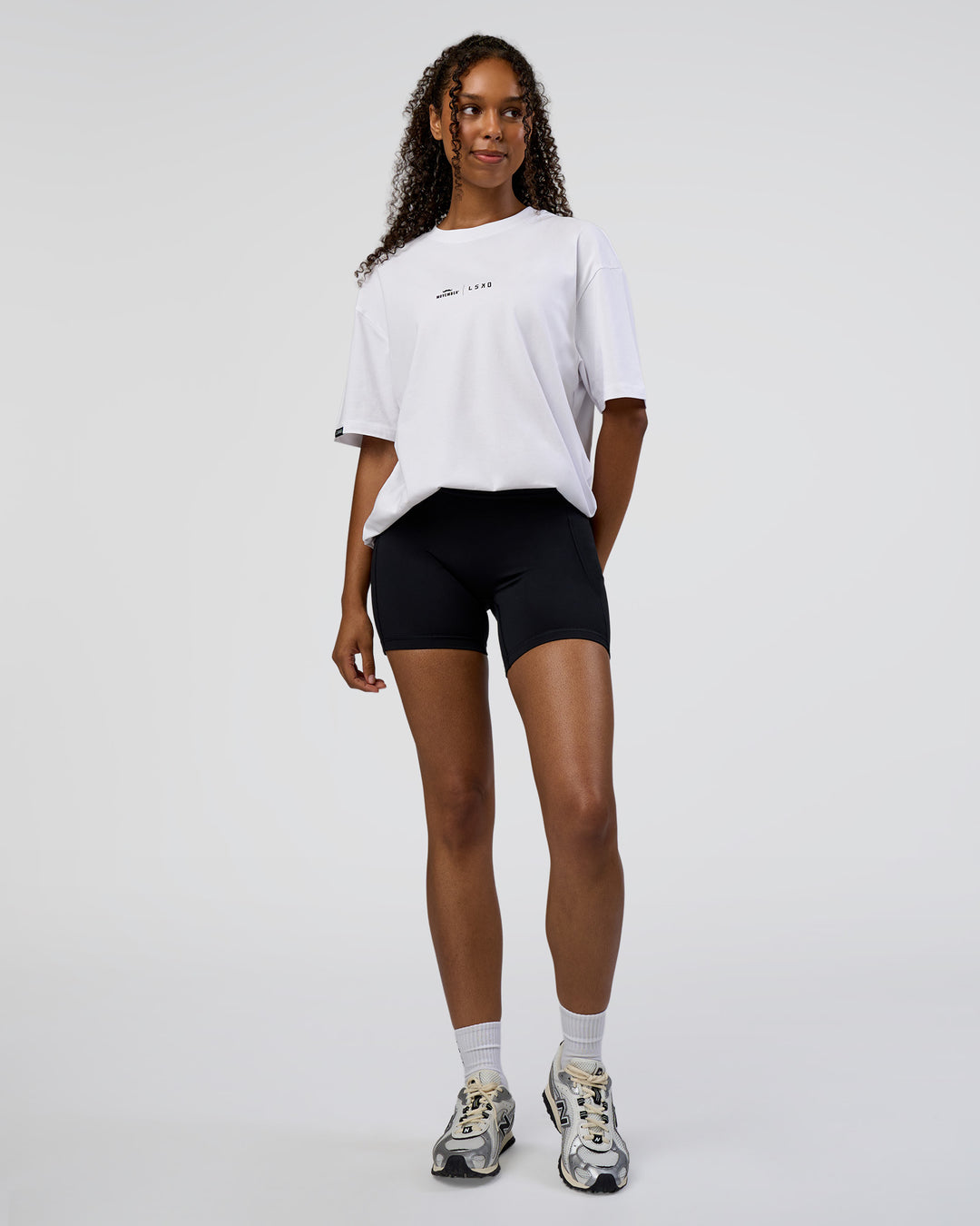 Woman wearing Movember 2025 FLXCotton Oversize Tee - White | Model:Jordan | Size:XS