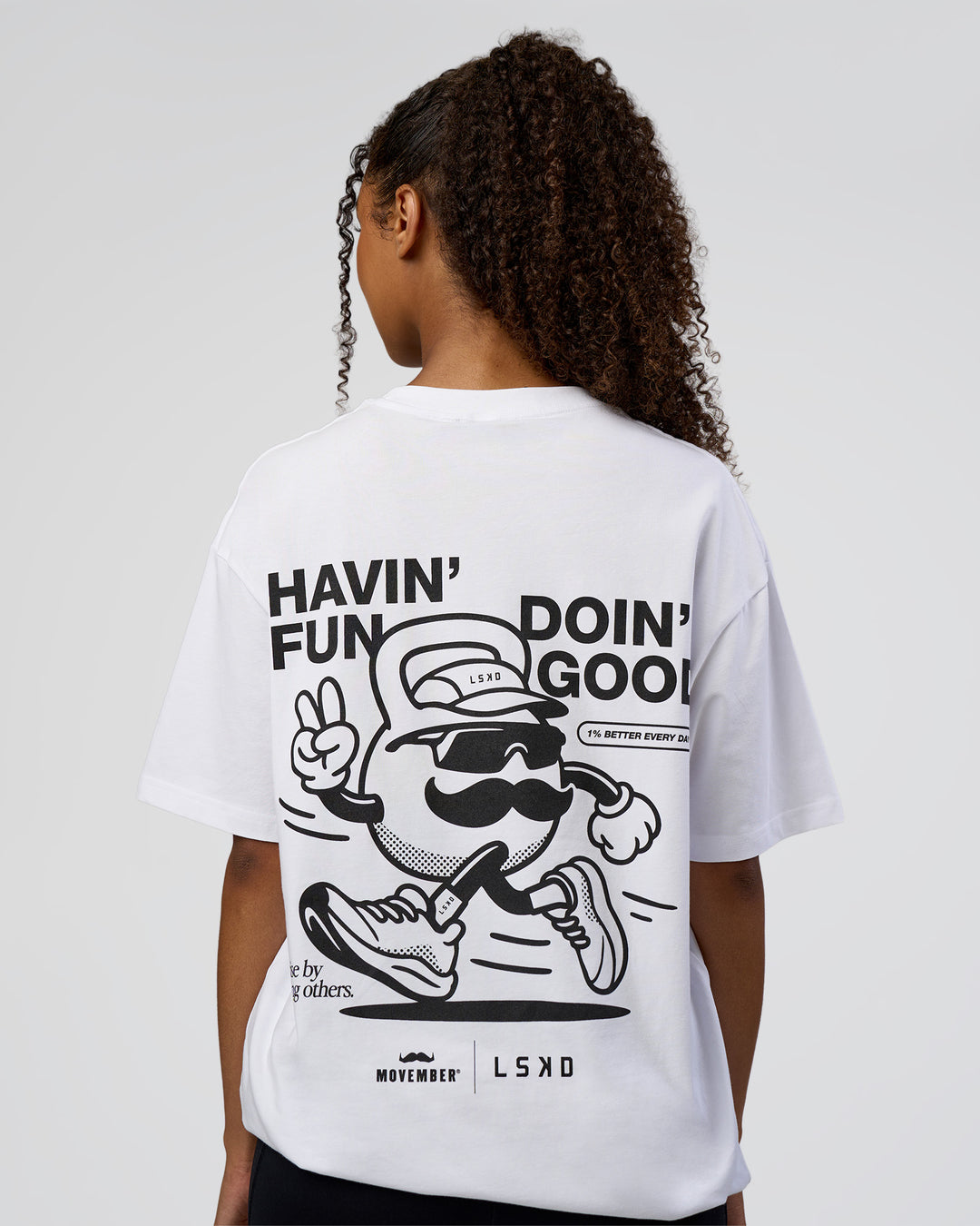 Woman wearing Movember 2025 FLXCotton Oversize Tee - White | Model:Jordan | Size:XS