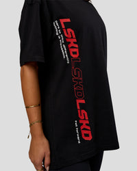 Woman wearing Nothing Is Impossible FLXCotton Oversized Tee - Black-Flame | Model:Bianca | Size:XS