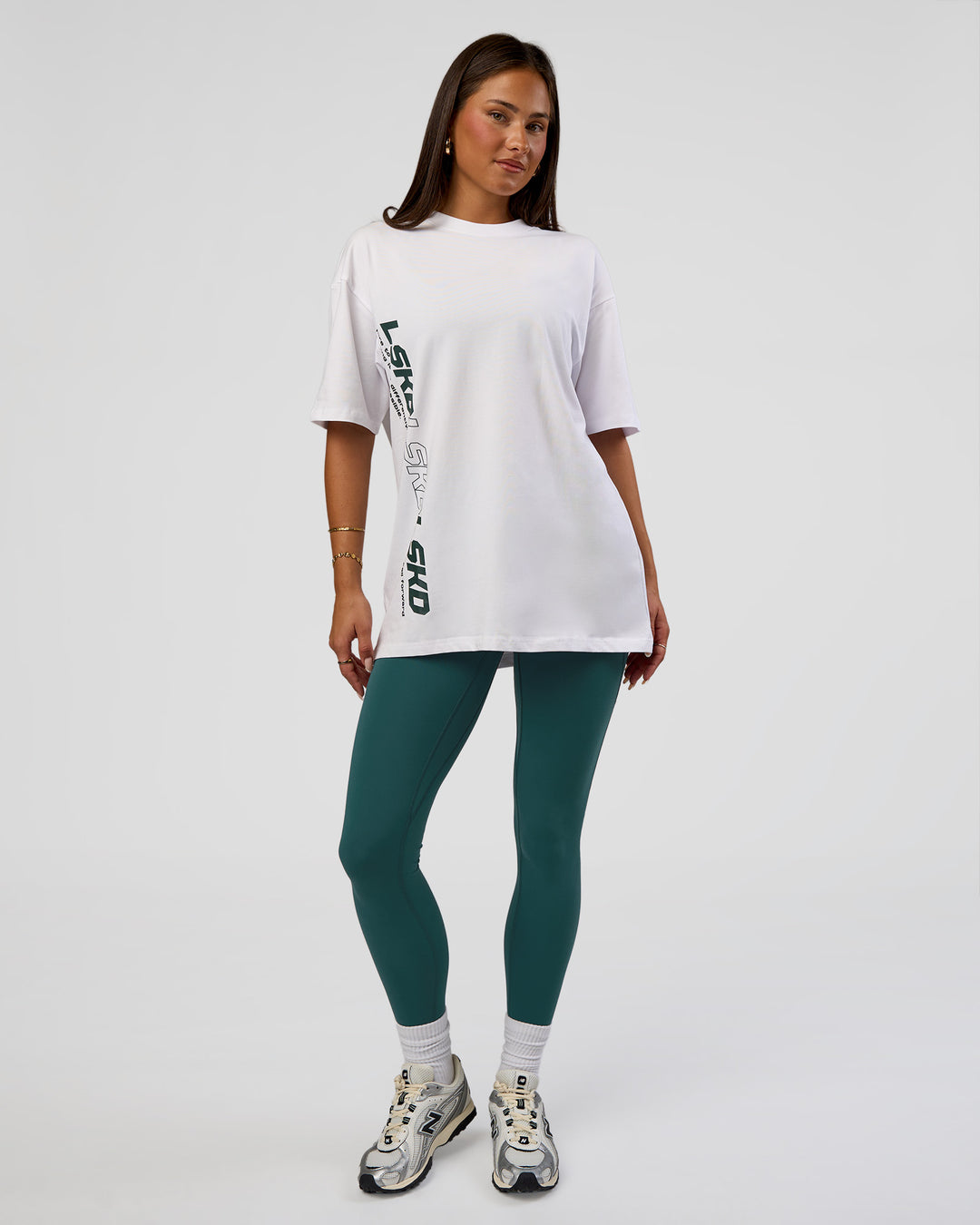 Woman wearing Nothing Is Impossible FLXCotton Oversized Tee - White-Vital Green | Model:Bianca | Size:XS