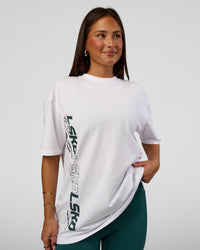 Woman wearing Nothing Is Impossible FLXCotton Oversized Tee - White-Vital Green | Model:Bianca | Size:XS