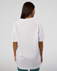 Woman wearing Nothing Is Impossible FLXCotton Oversized Tee - White-Vital Green | Model:Bianca | Size:XS