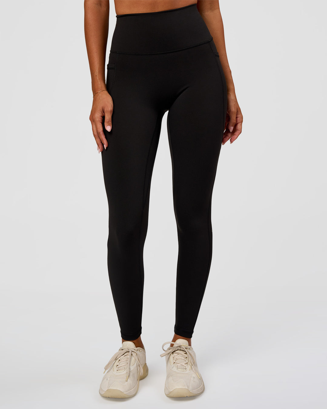 Woman wearing O.G Fusion Ultra High-Rise Full Length Legging Pockets - Black | Model:Charli | Size:XS