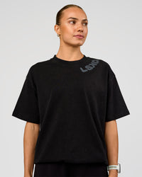 Woman wearing Offset Heavyweight Unisex Oversized Tee - Black Washed-Castlerock | Model:Maja | Size:XS
