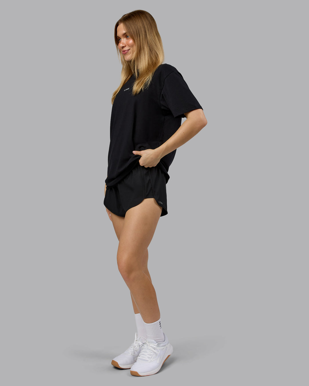 Woman wearing On Repeat FLXCotton Oversized Tee - Black-White | Model:Emilie | Size:XS