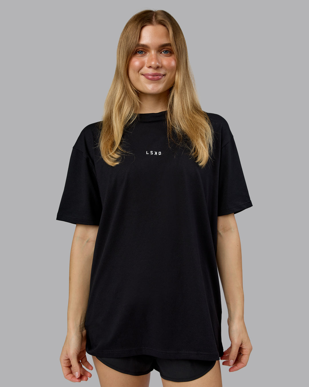 Woman wearing On Repeat FLXCotton Oversized Tee - Black-White | Model:Emilie | Size:XS