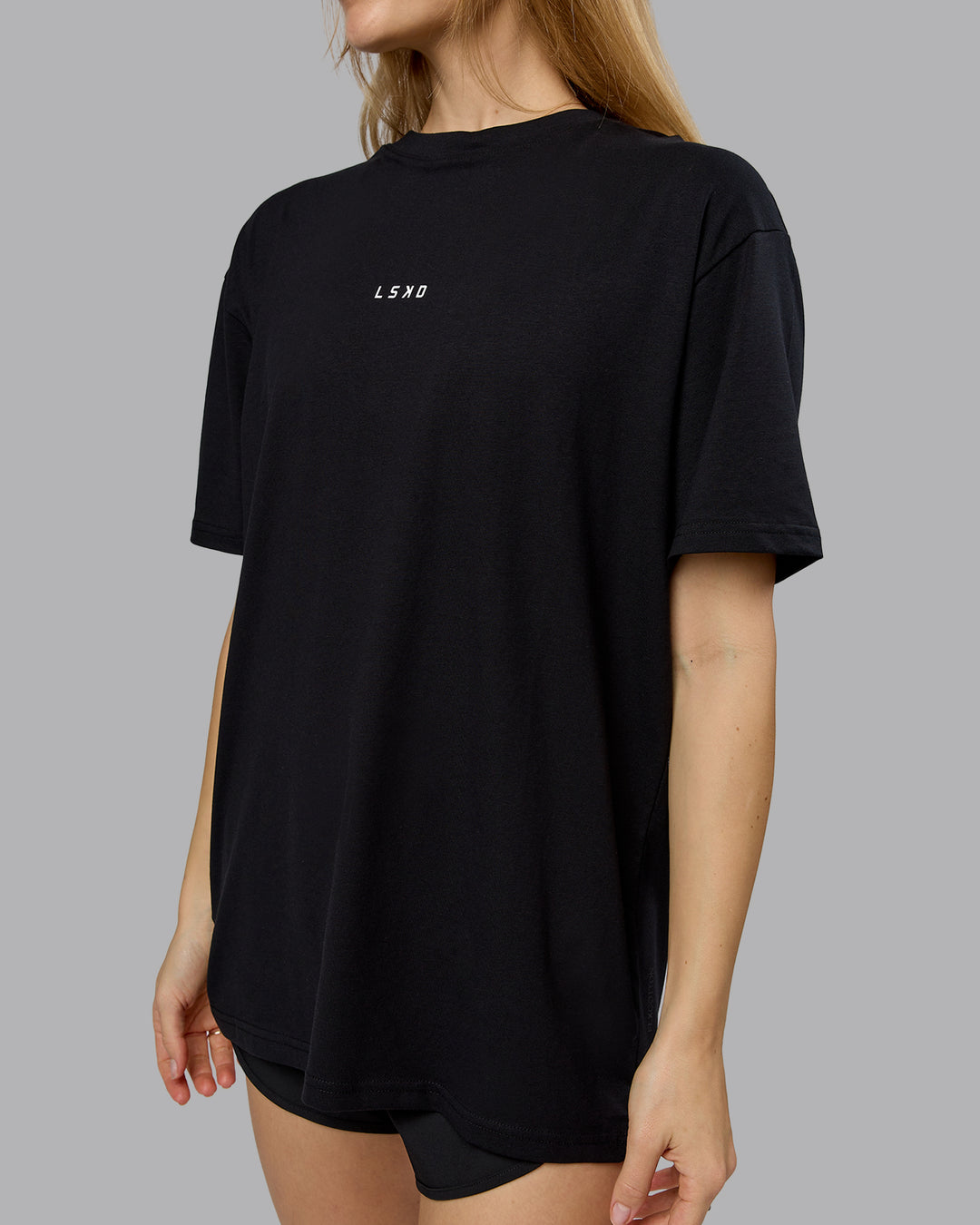 Woman wearing On Repeat FLXCotton Oversized Tee - Black-White | Model:Emilie | Size:XS